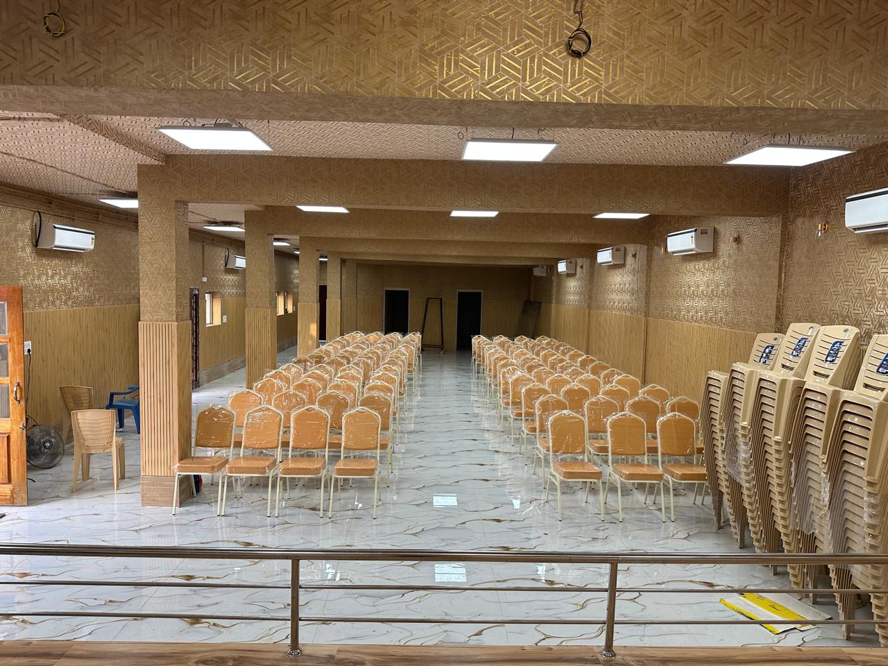 View of seating and central aisle in the downstairs hall