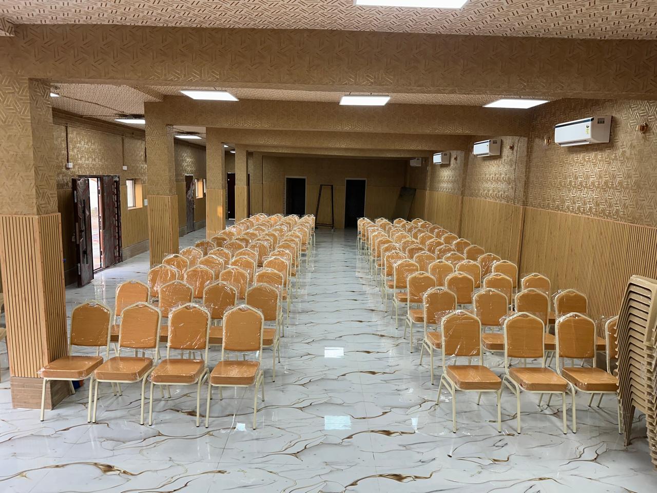 Chairs arranged for a ceremony in the downstairs air-conditioned hall